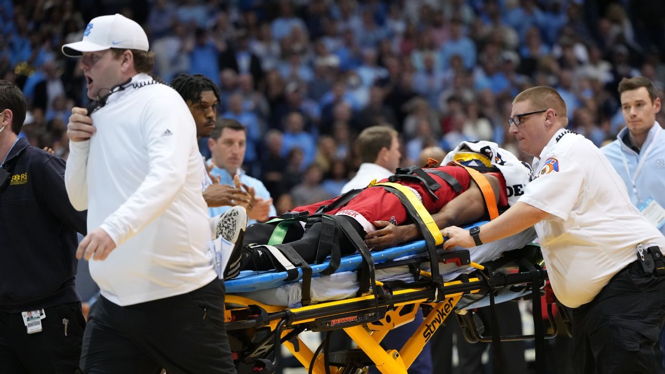 NC State's Terquavion Smith stretchered off after UNC foul