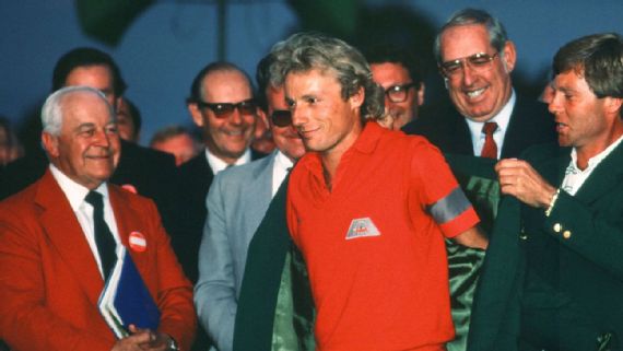 Langer slipping on his first green jacket in 1985.