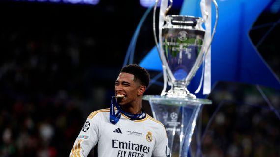 Jude Bellingham celebrates with the Champions League Trophy