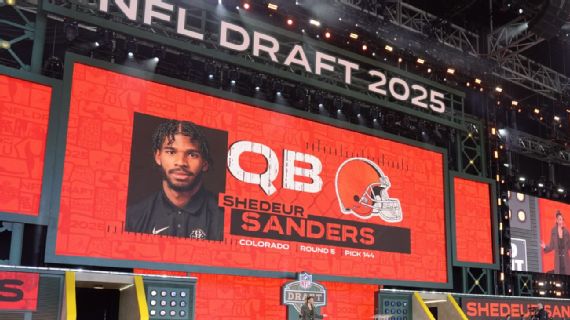 Shedeur Sanders and Browns helmet