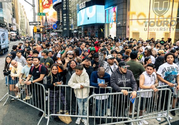 Boxing fans watching on a screen in Times Square