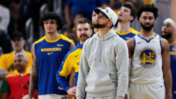 Stephen Curry sitting on bench