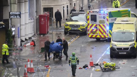 Scene‍ after⁣ a car drove into a crowd at Liverpool's title celebration.