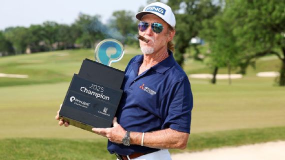 Miguel Angel Jimenez with the trophy after winning the principal Charity Classic.