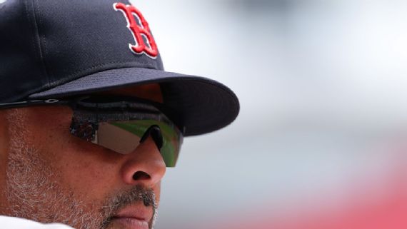 Red Sox manager Alex Cora looking dejected after another loss.