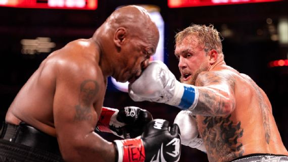 Jake Paul throwing a left hook