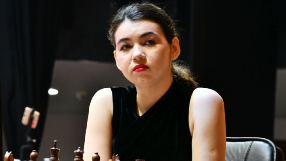 Alexandra Goryachkina at chess board