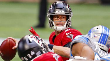 FILE - In this Dec. 27, 2020, file photo, Atlanta Falcons head coach Raheem  Morris walks on the sideline during the first half of an NFL football game  against the Kansas City