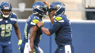 DK Metcalf of the Seattle Seahawks reacts after diving to make a