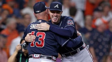 Atlanta Braves' Luke Jackson Cuddles Baby During World Series Game 3