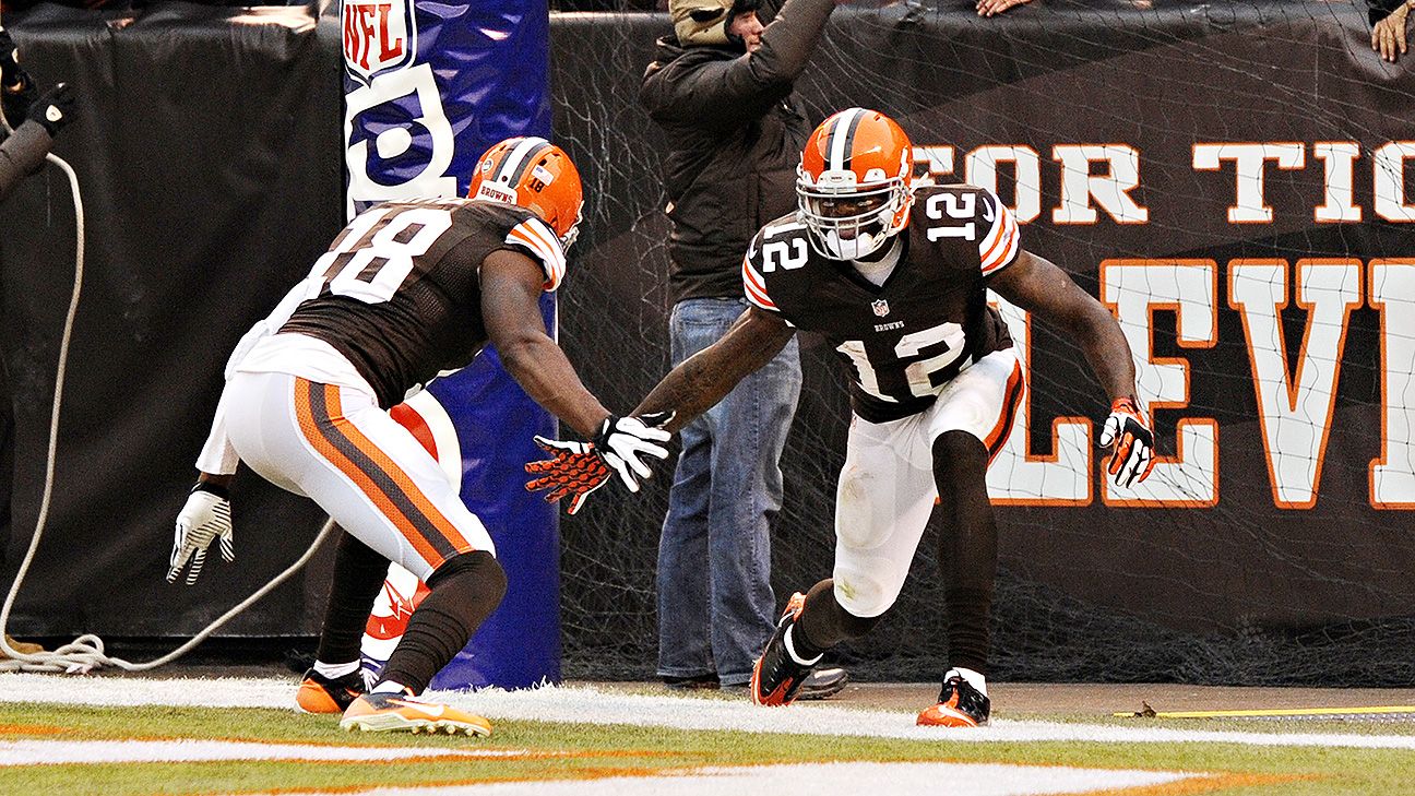 Miami Dolphins and Cleveland Browns players pose for photos after