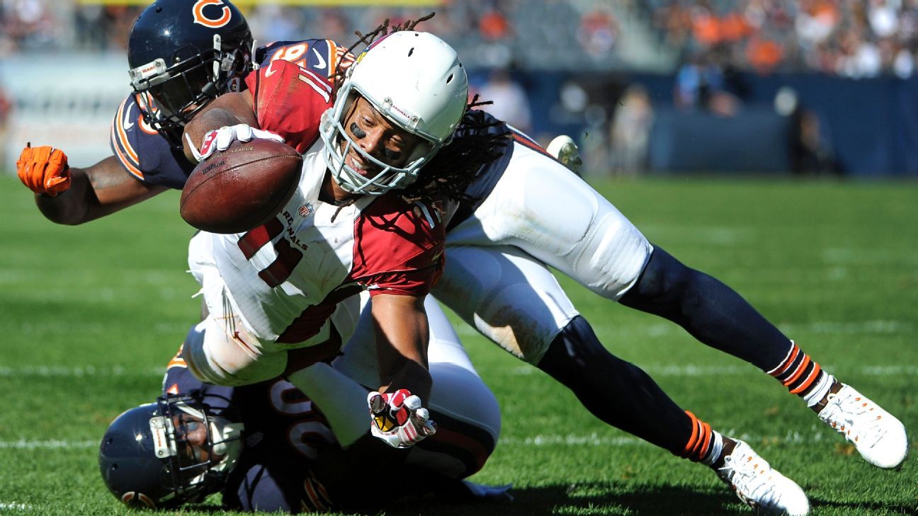 Arizona Cardinals' Larry Fitzgerald aided by Hines Ward