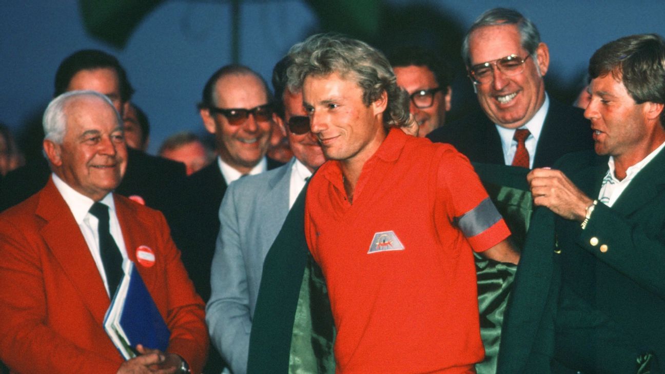 Langer slipping on his first green jacket in 1985.