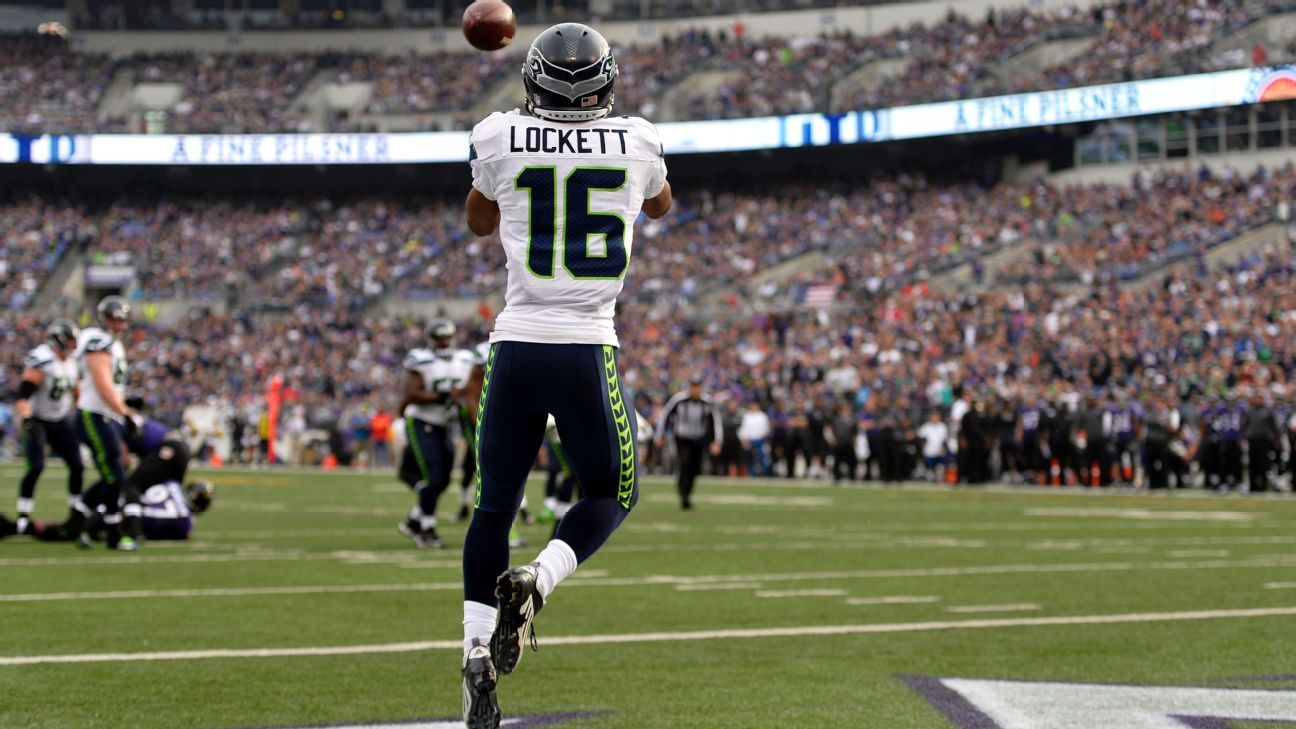 Seattle Seahawks wide receiver Tyler Lockett (16) looks on during