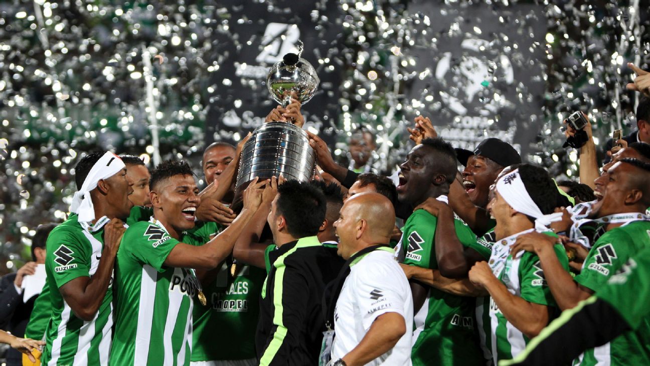 Fans of Atletico Nacional celebrate at the end of a second leg