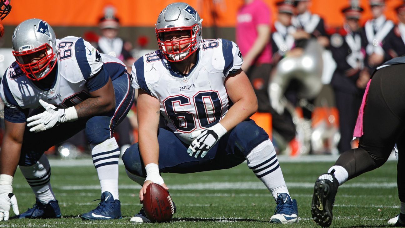 New England Patriots center David Andrews speaks with reporters