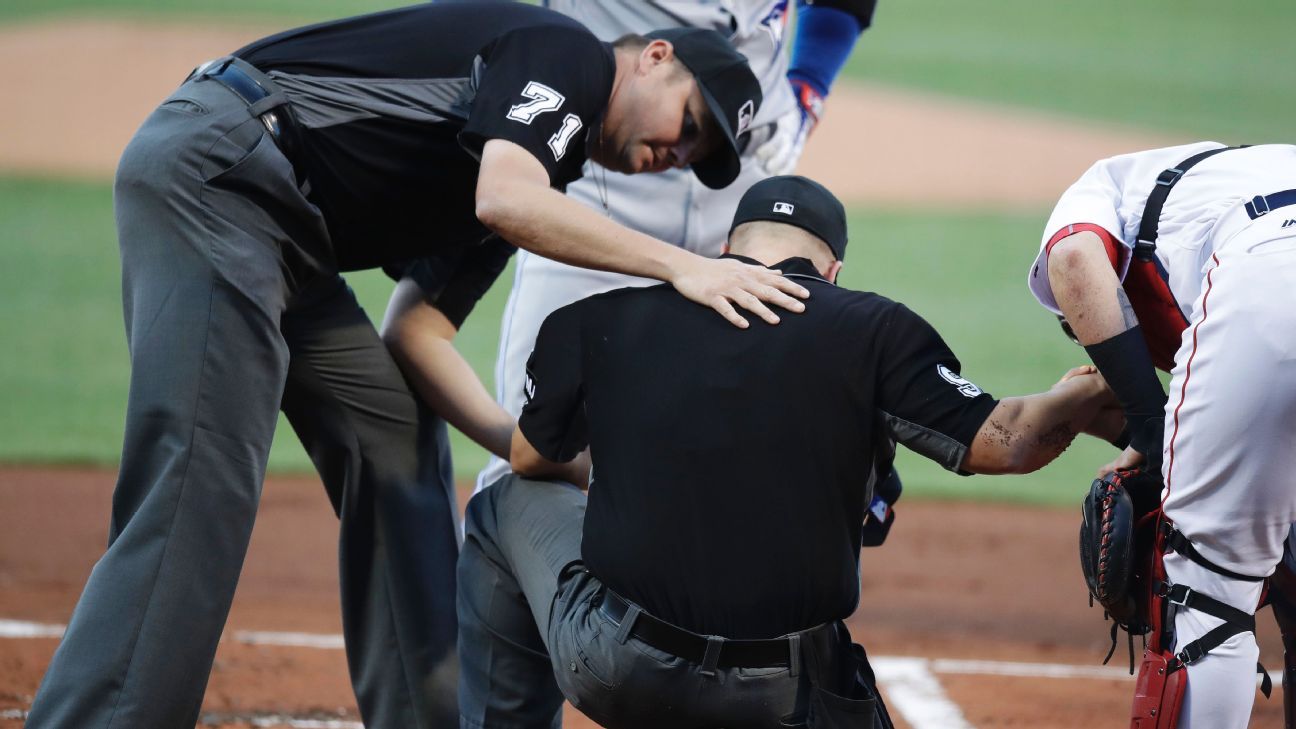 Plate umpire stays in after getting hit by Josh Donaldson's bat ESPN