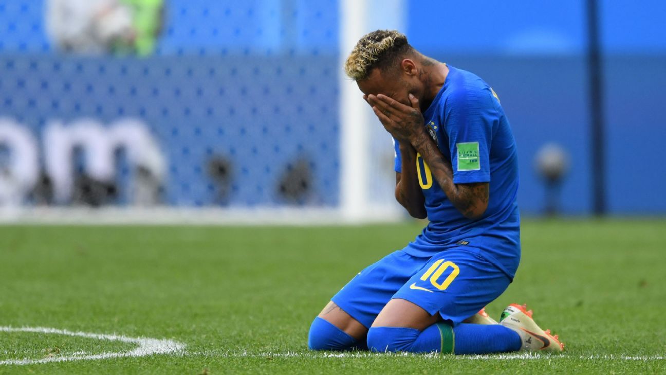 Male Professional Soccer Player Wearing A Brazil Yellow National Team Jersey  With The Number Ten On The Back Entering The Stadium Full Of Fans For A  Match. Stock Photo, Picture and Royalty