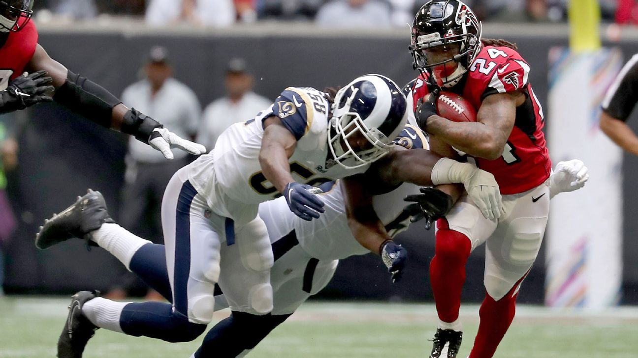 Devonta Freeman ejected for punching Aaron Donald in Rams, Falcons brawl -  Sports Illustrated