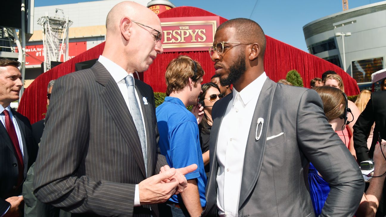 Kobe Bryant in street clothes talks to Chris Paul before the 2014 All Star  Game.JPG