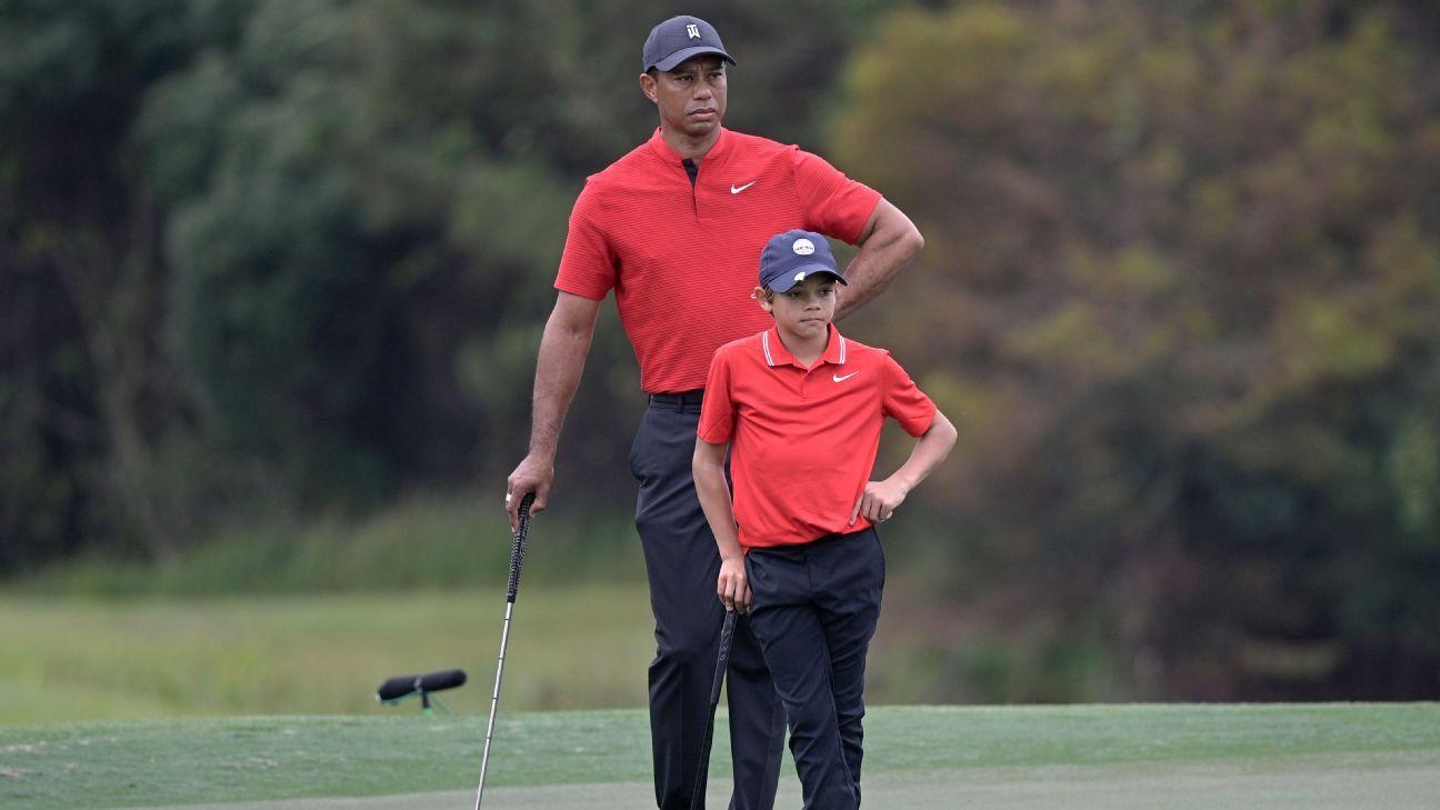 From club twirls to fist pumps to allergies, even Tiger Woods can't believe the similarities between him and his son, Charlie