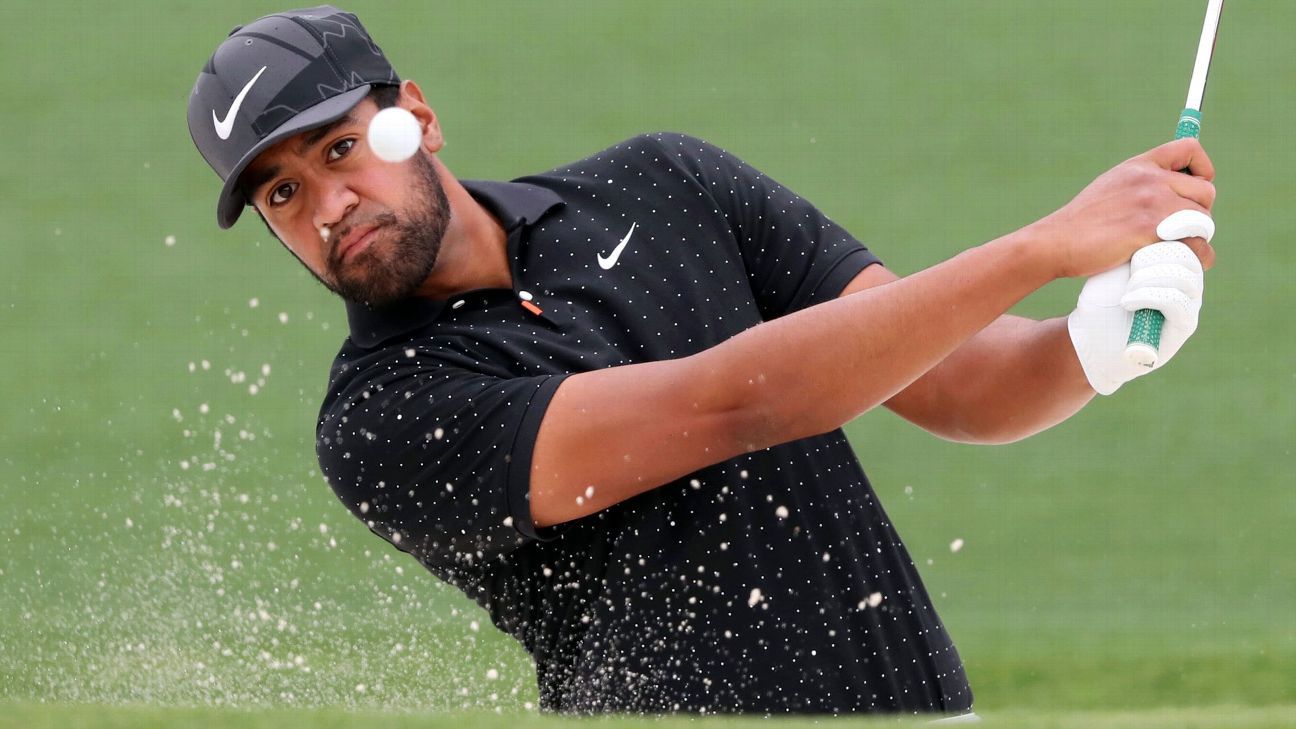 Tony Finau receives a surprise call from Tom Brady of the Tampa Bay Buccaneers during the Masters rain delay