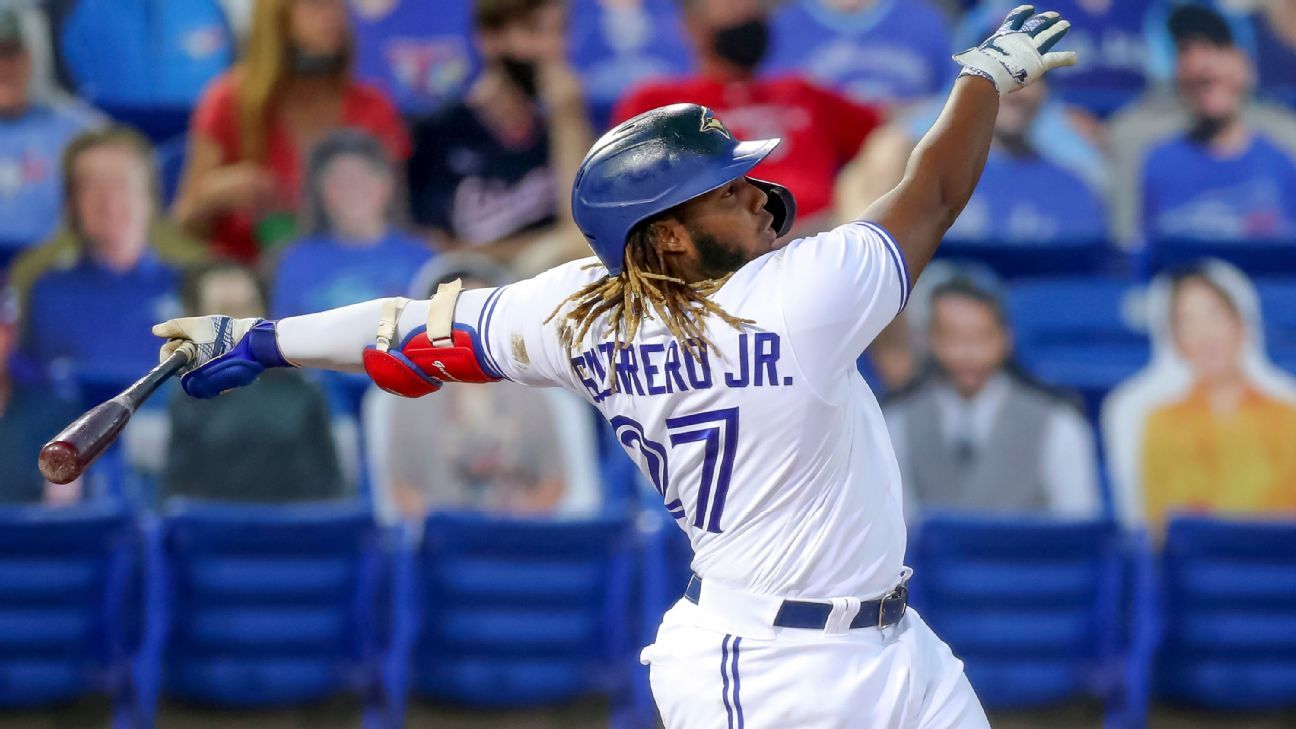 Download Vladimir Guerrero Jr. In Action - A Powerful Swing Wallpaper