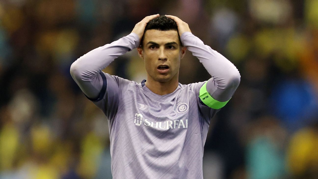 Cristiano Ronaldo removes his Real Madrid soccer jersey after his