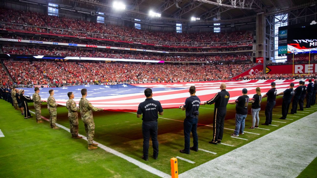 United States flags fly in center field before a baseball game