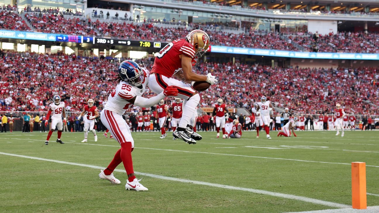 Ronnie Bell of the San Francisco 49ers runs with the ball of a