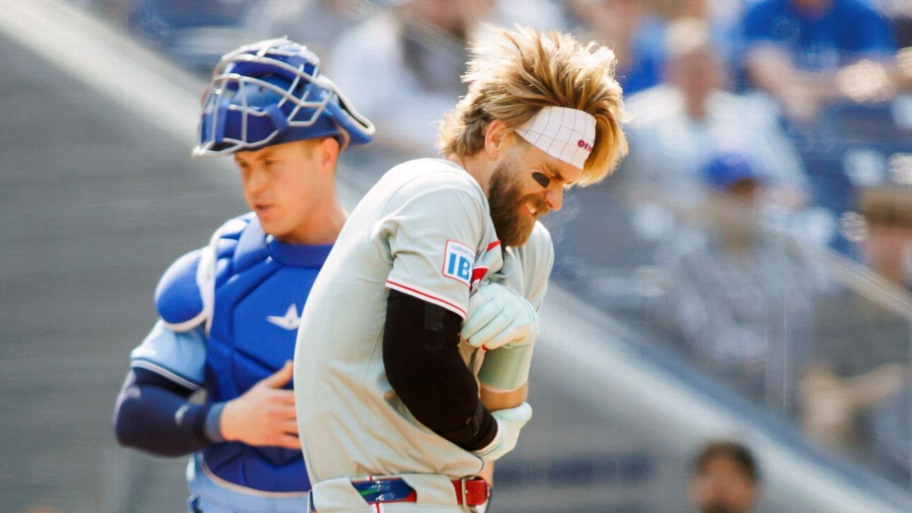 Bryce Harper of the Phillies is hit by a pitch on the left elbow and leaves the game