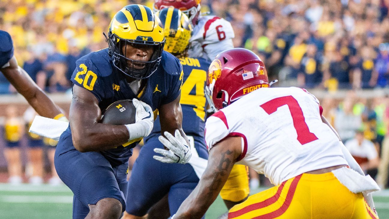 Michigan, limited to 32 yards passing, relies on running strength and beats USC