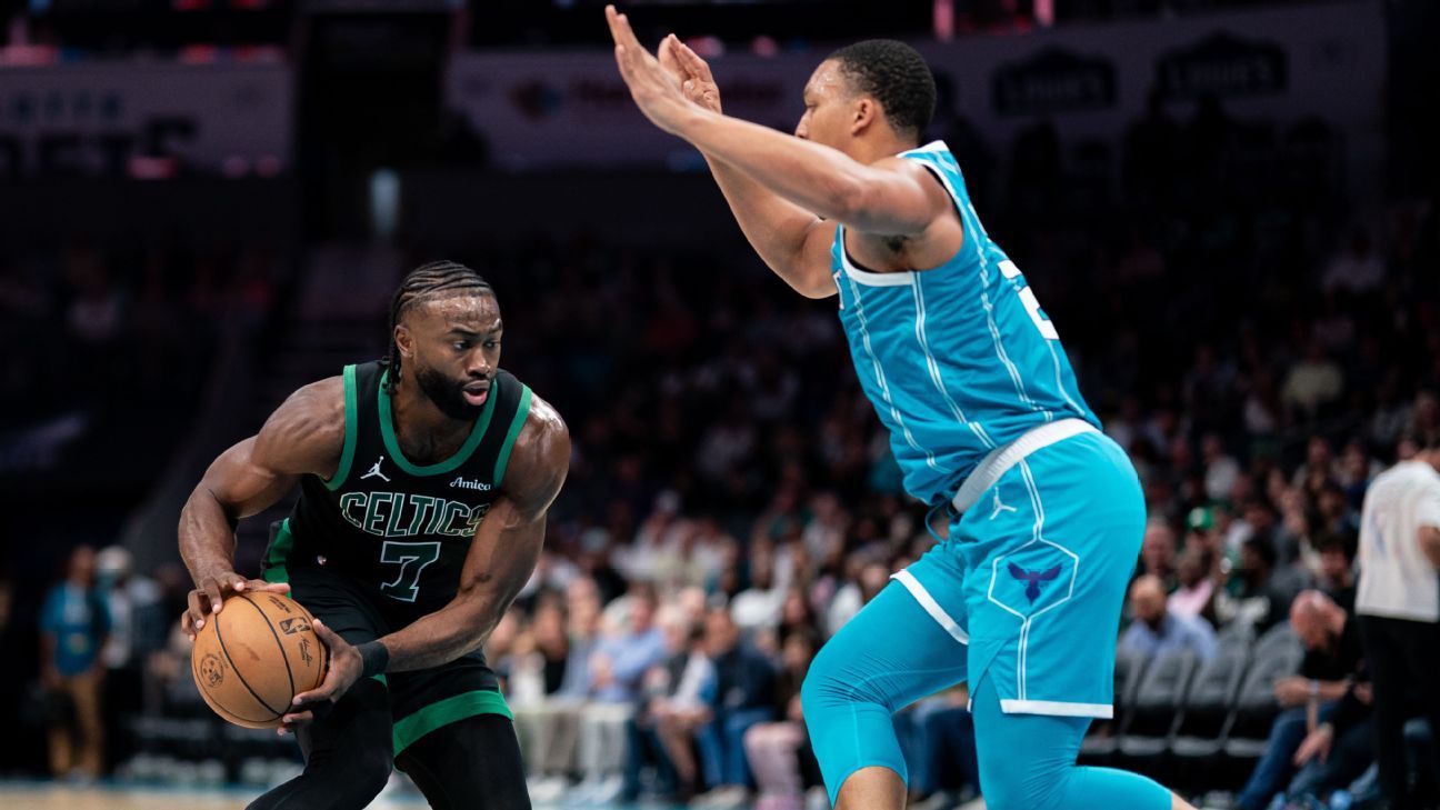 Brown of the Celtics confronts Williams of the Hornets about a foul on Tatum