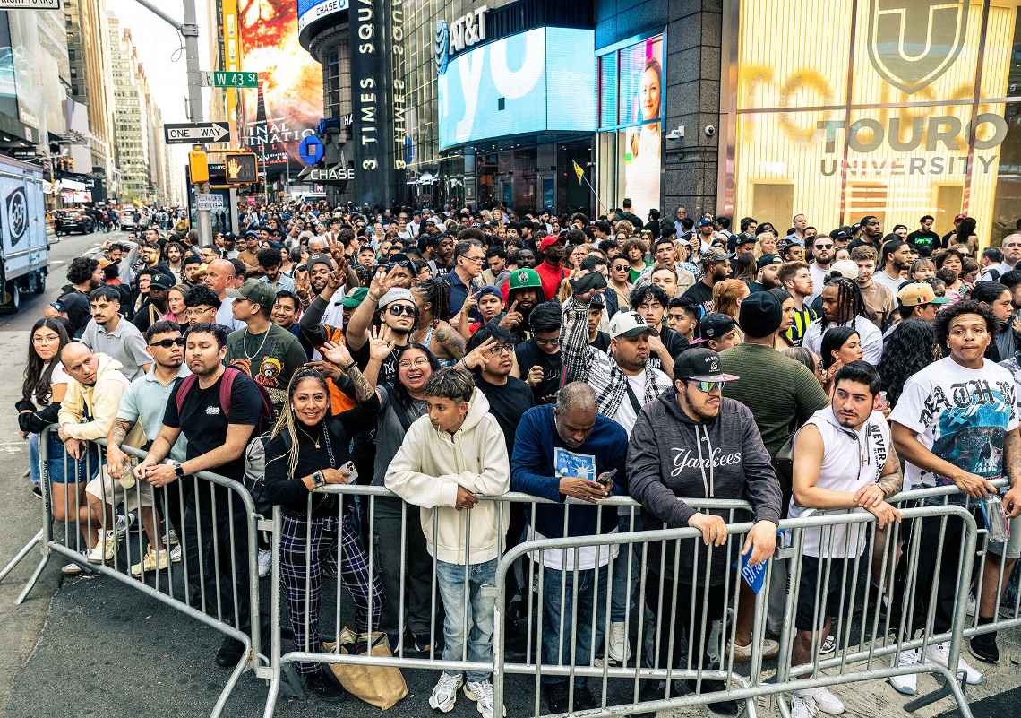 Fans watching boxing in Times Square