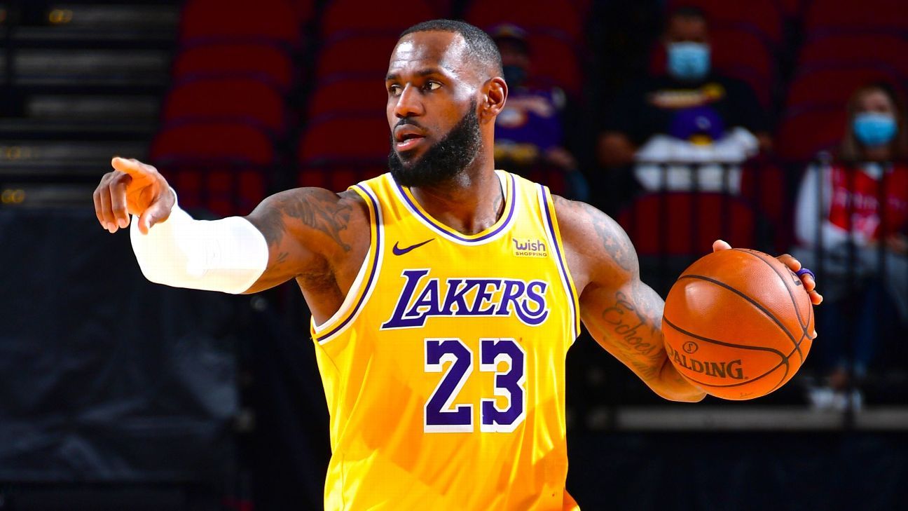 Los Angeles Lakers’ LeBron James talks to Brooklyn Nets trio before game