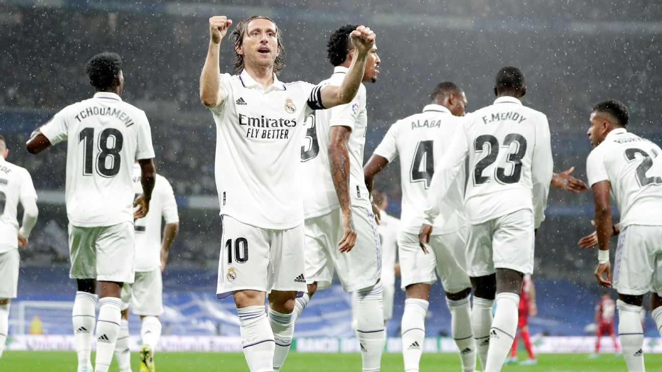 Photo of Modric fills in for Benzema as Madrid dig deep to beat Sevilla
