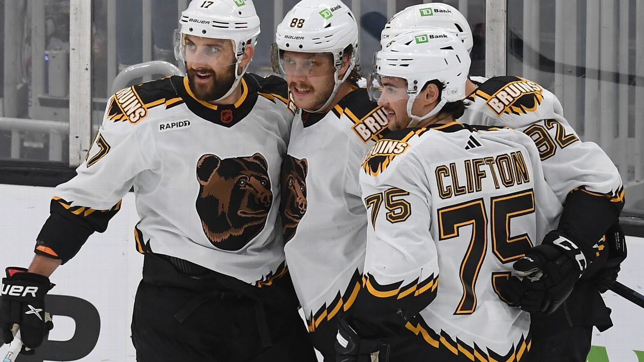Surging Bruins tie NHL record with 11th straight home win